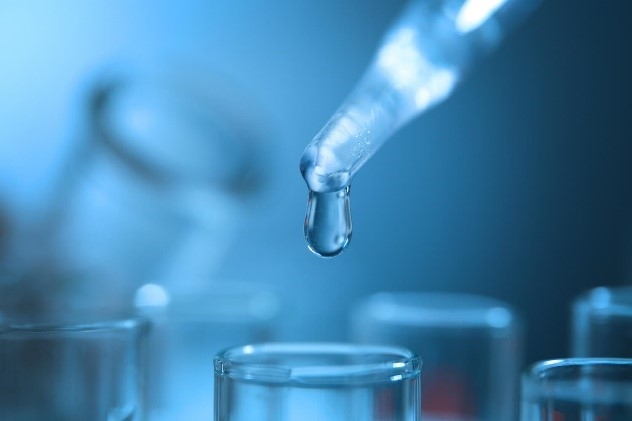 photo of a dropper and test tubes